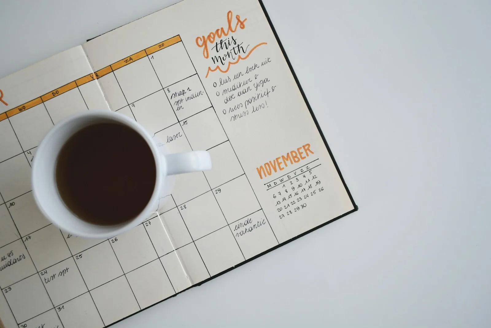 Coffee cup on a monthly planner