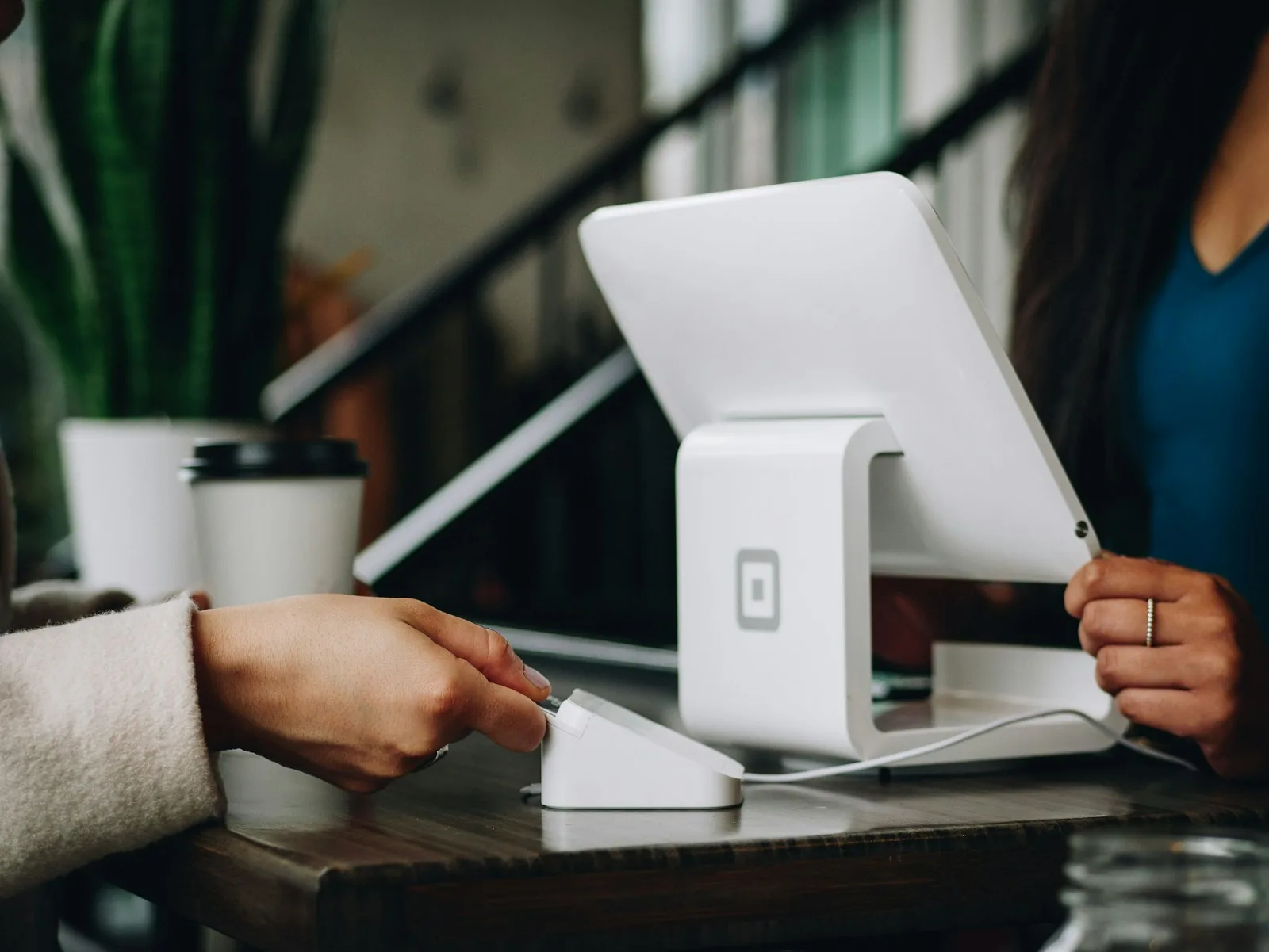Customer paying at a tablet point-of-sale