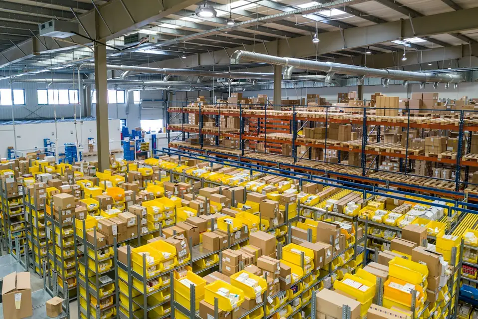 Warehouse aisles stacked with parcels