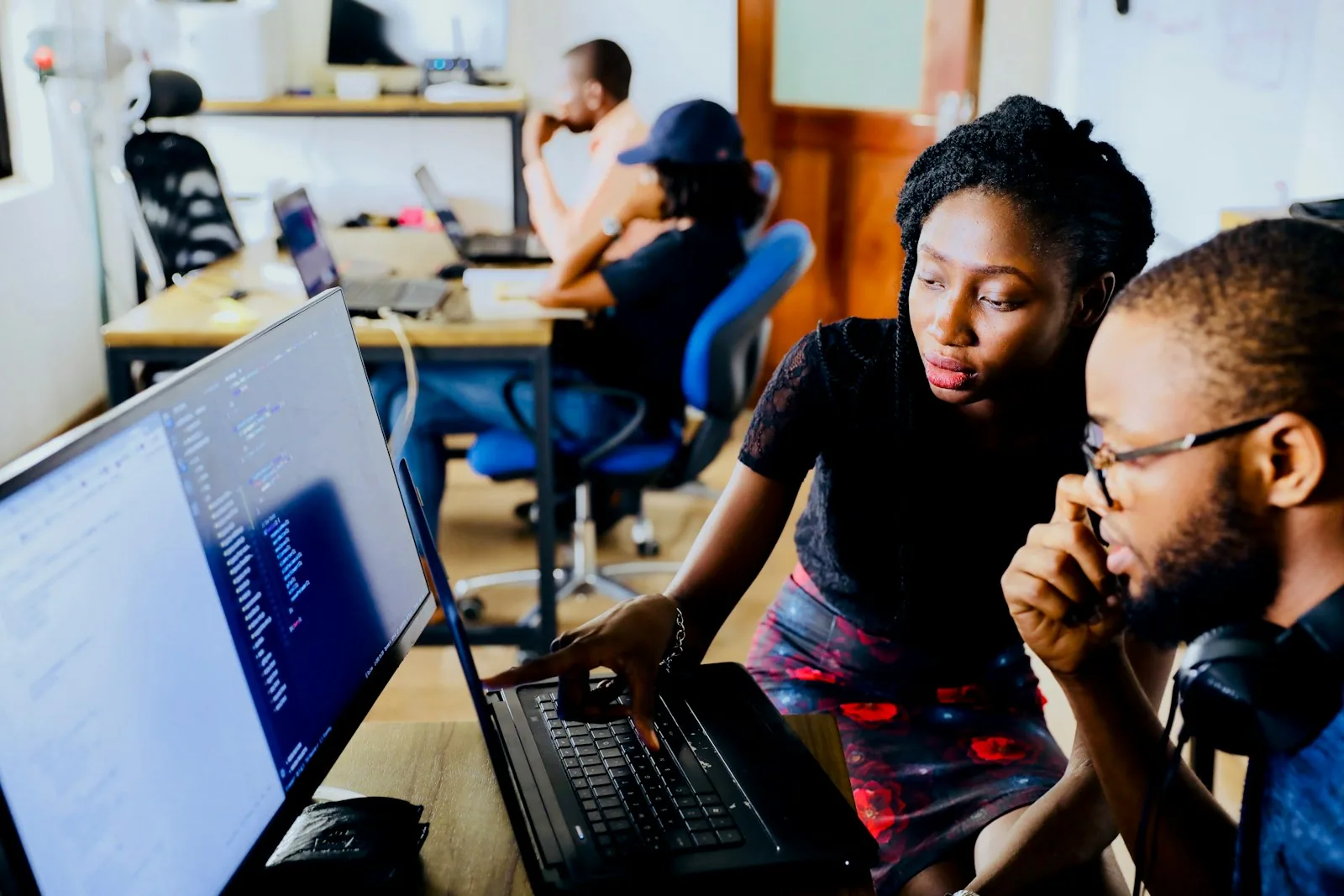 Startup team working together at a computer